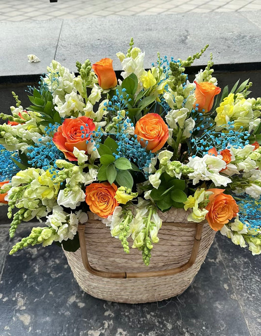 Orange Basket with Blue Baby Flowers