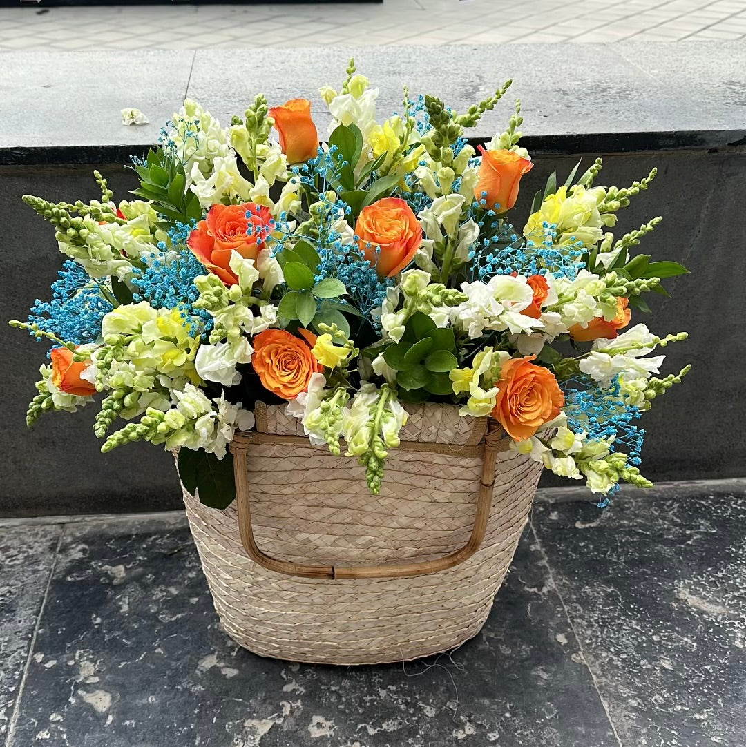 Orange Basket with Blue Baby Flowers